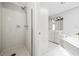 An all-white bathroom with a soaking tub and shower at 5065 Avalon Dr, Alpharetta, GA 30005