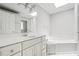 An elegant bathroom with a soaking tub and double sink vanity at 5065 Avalon Dr, Alpharetta, GA 30005