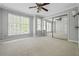 This room offers carpeted floors, mirrored closet doors, and lots of natural light at 5065 Avalon Dr, Alpharetta, GA 30005