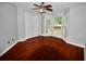 Cozy bedroom with hardwood floors and large windows offering great natural light at 5065 Avalon Dr, Alpharetta, GA 30005