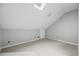 Bright bonus room with dormer window and neutral carpet at 5065 Avalon Dr, Alpharetta, GA 30005
