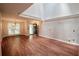 Bright living room with hardwood floors, large windows, and an entryway door at 5065 Avalon Dr, Alpharetta, GA 30005