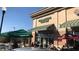View of the storefront of a Starbucks coffee shop with outdoor seating and a recognizable logo at 5065 Avalon Dr, Alpharetta, GA 30005