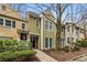 Charming townhouse featuring a well-maintained exterior and inviting front walkway to the covered front porch at 5065 Avalon Dr, Alpharetta, GA 30005