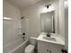 Bright bathroom featuring a tub and shower combination, with a stylish white vanity at 5459 Blossomwood Sw Trl, Mableton, GA 30126