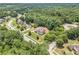 Aerial view of beautiful home nestled in a lush, green neighborhood at 135 Waterlace Way, Fayetteville, GA 30215