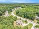Aerial view showcasing a desirable community with luxurious homes and mature trees at 135 Waterlace Way, Fayetteville, GA 30215