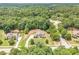 Lush community surrounding a sprawling two-story home at 135 Waterlace Way, Fayetteville, GA 30215