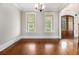 Dining room features hardwood floors, neutral walls, and large windows overlooking the trees at 135 Waterlace Way, Fayetteville, GA 30215