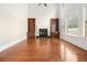 Spacious living room features a fireplace, built-in bookshelves, and large windows for natural light at 135 Waterlace Way, Fayetteville, GA 30215