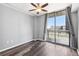 Bedroom with sliding glass doors and wood-look flooring at 3040 Peachtree Nw Rd # 613, Atlanta, GA 30305