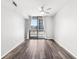 A bedroom with hardwood floors and a balcony, offering city views and natural light at 3040 Peachtree Nw Rd # 613, Atlanta, GA 30305
