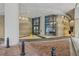 Welcoming building entrance with brick columns, brick floor, and ample light at 3040 Peachtree Nw Rd # 613, Atlanta, GA 30305
