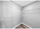 Spacious walk-in closet with multiple shelving units for organized storage at 3040 Peachtree Nw Rd # 613, Atlanta, GA 30305