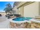 Outdoor fountain area and grill station with brick pavers and manicured landscaping at 3040 Peachtree Nw Rd # 613, Atlanta, GA 30305