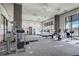 Bright community gym with large windows and exercise equipment, including treadmills and weight machines at 3040 Peachtree Nw Rd # 613, Atlanta, GA 30305