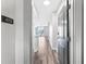 Hallway featuring hardwood floors that lead into a bright living space with balcony access and natural light at 3040 Peachtree Nw Rd # 613, Atlanta, GA 30305