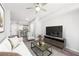 Nicely staged living room with modern decor and ceiling fan at 3040 Peachtree Nw Rd # 613, Atlanta, GA 30305