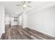 This modern living room features wood-look flooring and neutral walls at 3040 Peachtree Nw Rd # 613, Atlanta, GA 30305