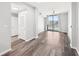 A living room with hardwood floors, a balcony, and natural light creating a bright space at 3040 Peachtree Nw Rd # 613, Atlanta, GA 30305