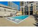 Modern pool featuring sun loungers, clear water and access to nearby lounge areas at 3040 Peachtree Nw Rd # 613, Atlanta, GA 30305