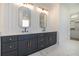 Modern bathroom features double vanity with marble countertops and brass hardware at 4332 Kay Morgan Rd, Buford, GA 30519