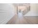 Spacious foyer with hardwood floors, paneled accent walls, and an elegant staircase with metal railing at 4332 Kay Morgan Rd, Buford, GA 30519