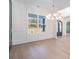 Open-concept living room with hardwood floors, natural light and decorative chandelier at 4332 Kay Morgan Rd, Buford, GA 30519