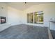 Spacious outdoor patio with a fireplace, bar and sliding glass doors leading to the backyard at 4332 Kay Morgan Rd, Buford, GA 30519