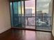 Condo features a large glass door leading to a balcony with city views at 1080 Peachtree Ne St # 2915, Atlanta, GA 30309