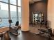 Modern gym featuring weight lifting equipment and floor-to-ceiling windows at 1080 Peachtree Ne St # 2915, Atlanta, GA 30309