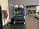 Modern gym featuring free weights with a mirrored wall and treadmills at 1080 Peachtree Ne St # 2915, Atlanta, GA 30309