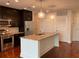 Modern kitchen features stainless steel appliances, granite countertops, and a spacious island with pendant lighting at 1080 Peachtree Ne St # 2915, Atlanta, GA 30309