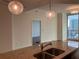 Open-concept kitchen with granite island and skyline view at 1080 Peachtree Ne St # 2915, Atlanta, GA 30309