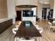 A communal dining area features a long table, pendant lighting, and stylish decor at 1080 Peachtree Ne St # 2915, Atlanta, GA 30309
