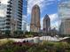 Picturesque rooftop garden with lush greenery, seating areas, and city skyline views at 1080 Peachtree Ne St # 2915, Atlanta, GA 30309