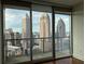 Stunning city skyline views from the floor-to-ceiling windows and balcony offer a picturesque living experience at 1080 Peachtree Ne St # 2915, Atlanta, GA 30309