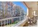 Relax on this condo's balcony with beautiful views, complete with outdoor seating and fresh air at 211 Colonial Homes Nw Dr # 1303, Atlanta, GA 30309