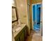 Bathroom features a vanity with stone countertops, tiled flooring, and a glass door shower at 3251 Abbeywood Dr, Decatur, GA 30034
