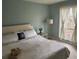 Serene bedroom with soft, natural lighting, comfortable bed, and view from the window at 3251 Abbeywood Dr, Decatur, GA 30034