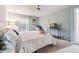 Cozy bedroom featuring neutral walls, carpet and a ceiling fan offering a bright and airy feel at 3251 Abbeywood Dr, Decatur, GA 30034