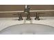 Close-up of a brushed nickel faucet atop a vanity, blending style with essential functionality at 3251 Abbeywood Dr, Decatur, GA 30034
