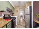 Practical kitchen design with stainless steel appliances, gas range, and olive-green cabinets for a classic feel at 3251 Abbeywood Dr, Decatur, GA 30034