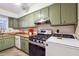 Well-equipped kitchen with olive cabinets, a gas stove, stainless steel appliances, and a clean, functional design at 3251 Abbeywood Dr, Decatur, GA 30034
