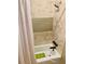 Shower over tub features multi-pattern tilework and modern fixtures at 3251 Abbeywood Dr, Decatur, GA 30034
