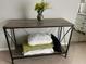 Stylish table with vase of flowers and storage below at 3251 Abbeywood Dr, Decatur, GA 30034