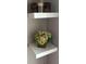 Wall corner decor with floating shelves, showcasing modern design and decorative items for added style at 3251 Abbeywood Dr, Decatur, GA 30034