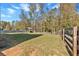 Fenced in backyard with wooden cabana, perfect for recreation at 3890 Pleasant Woods Dr, Cumming, GA 30028
