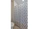 Bathroom featuring toilet and tub with shower at 3890 Pleasant Woods Dr, Cumming, GA 30028