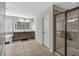 Bright bathroom features a soaking tub, a separate glass-enclosed shower, and a double sink vanity with ample storage at 3890 Pleasant Woods Dr, Cumming, GA 30028